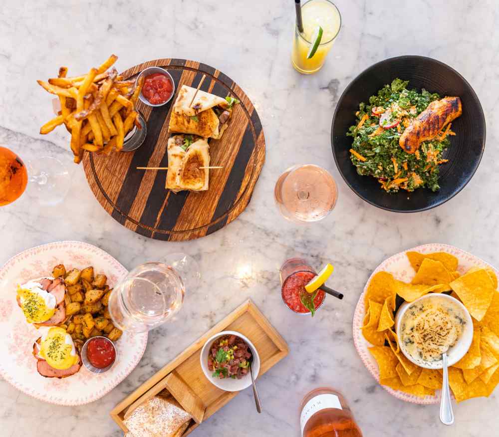 Fresh, vibrant bites at Orange Blossom Miami Beach—salmon salad, wraps, nachos, and brunch favorites in a stylish, sunny setting.