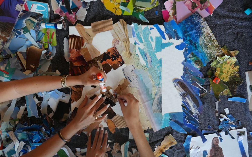 Group off-screens collage activity at WeWork Coral Gables.