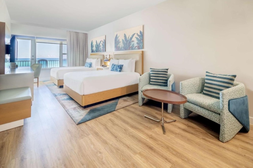 Ocean view junior studio with 2 queen beds, a balcony, sitting area and a microwave