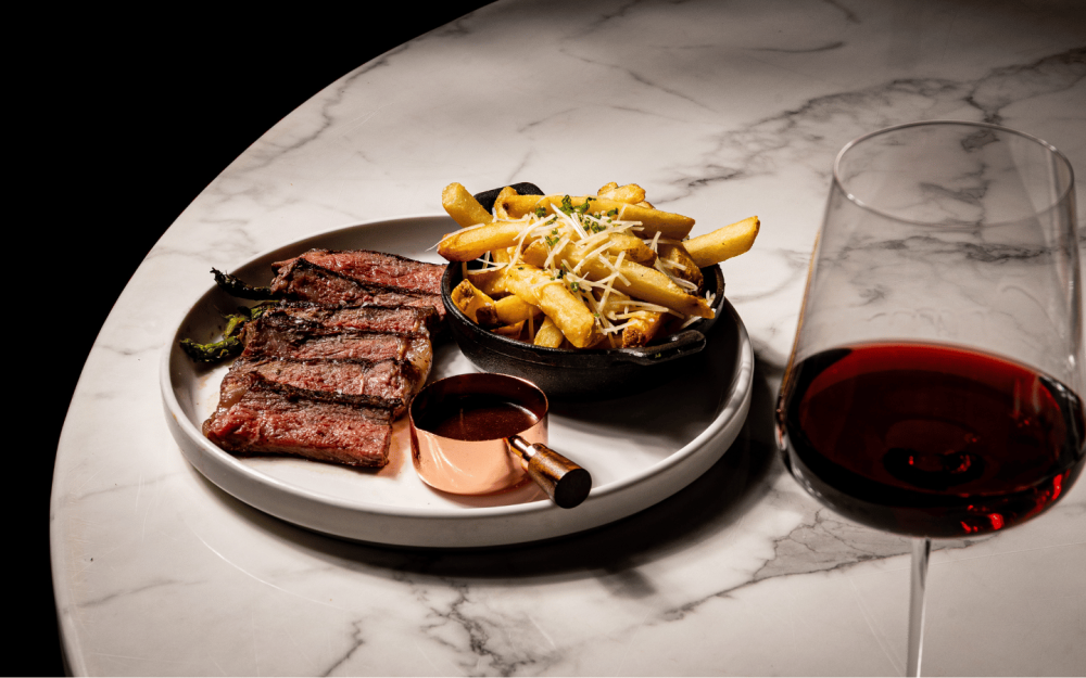 Prime NY Strip Steak (8 oz) — Truffle parmesan fries, grilled asparagus, bordelaise sauce