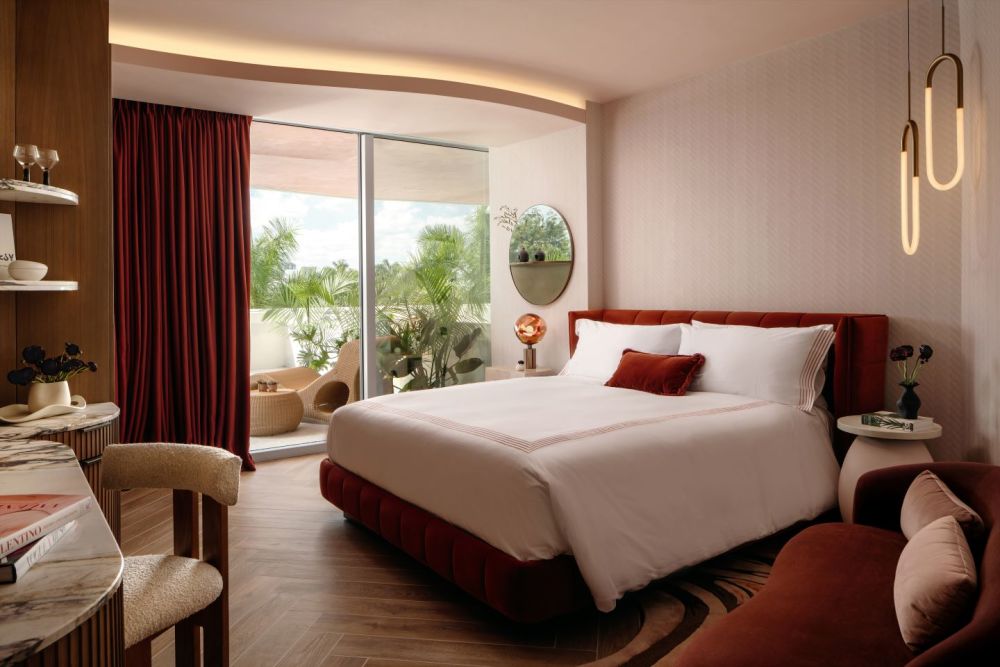 Guest room with king bed and balcony