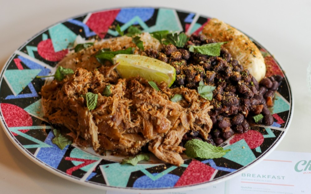 White Rice, Black Beans, Banana, Choice of: Lechón, Pollo a la Plancha, or Chicharron
