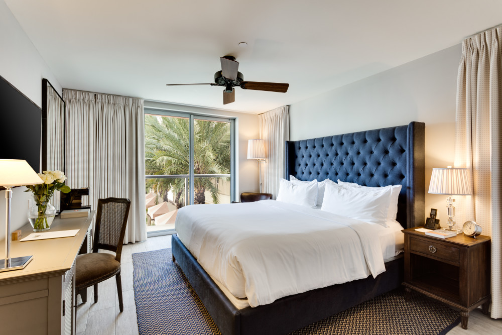 Vibrant foliage give an alluring romantic vibe in our Juliette Balcony Pool View room. Perfect for lounging and unwinding after a long day exploring Miami Beach. 
Choose between a spacious king bed or opt for a double bed for separate accommodations. All Juliette rooms offer prime views of our Art Deco pool, lavish hard-wood floors, luxury amenities, and a pristine French-style bathroom with enclosed rain shower that'll make you never want to leave.