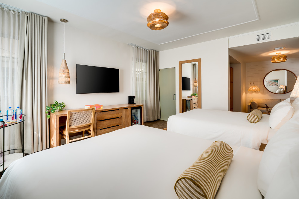 Newly renovated and beach chic, this Jr. Suite Double Queen features two queen beds, spacious sleeping and sitting areas, and relaxed style.