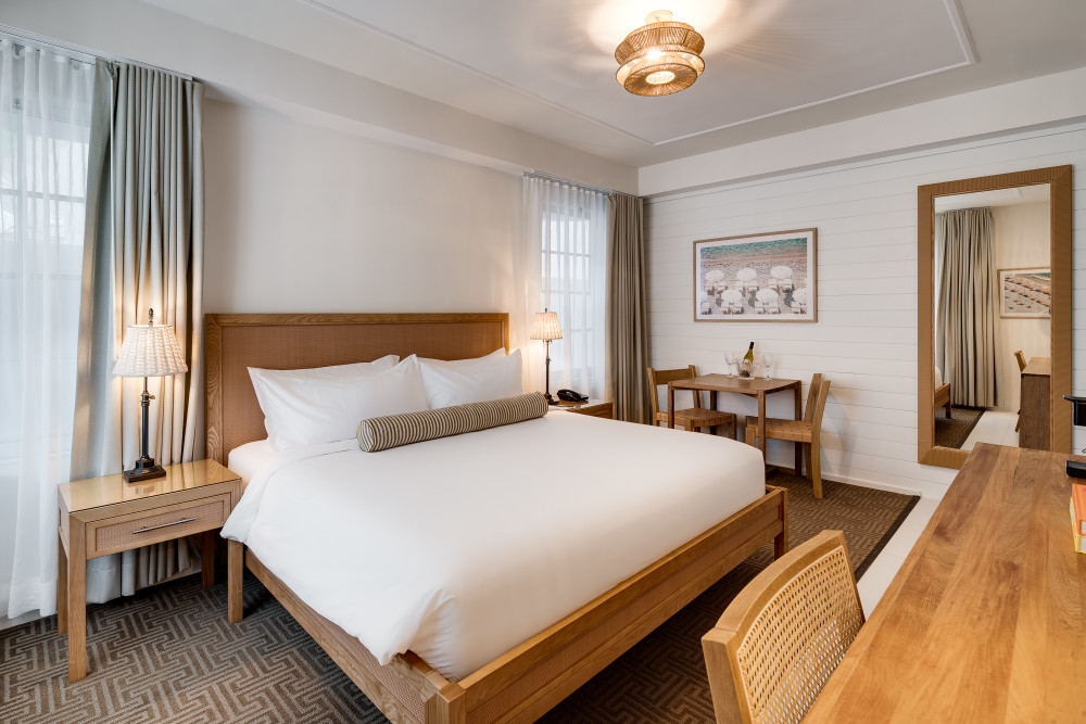 The Standard King Rooms blend beach-chic comfort with South Beach style, featuring Wi-Fi, a flatscreen TV, and a sleek modern bath.