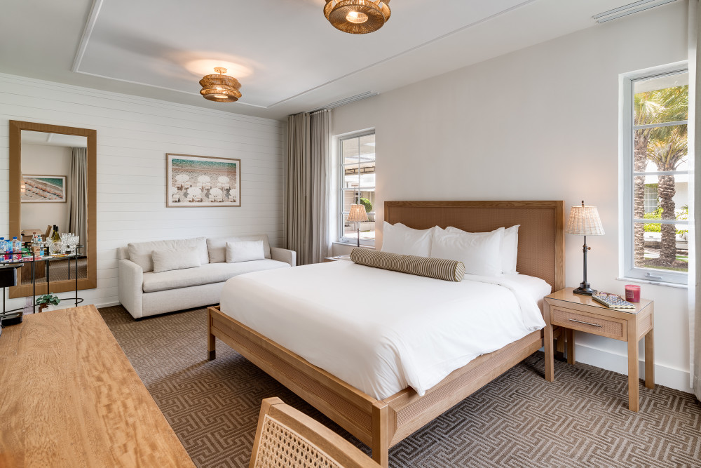 Newly renovated Jr. Suite King Park View offers a plush king bed, separate living area, cozy sofa, and relaxing views of the park courtyard.