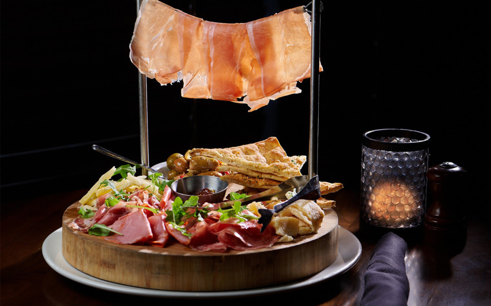 Italian meats & cheeses served with focaccia bread, and a mix of olives, red peppers, sun-dried tomatoes, artichoke hearts, and onions