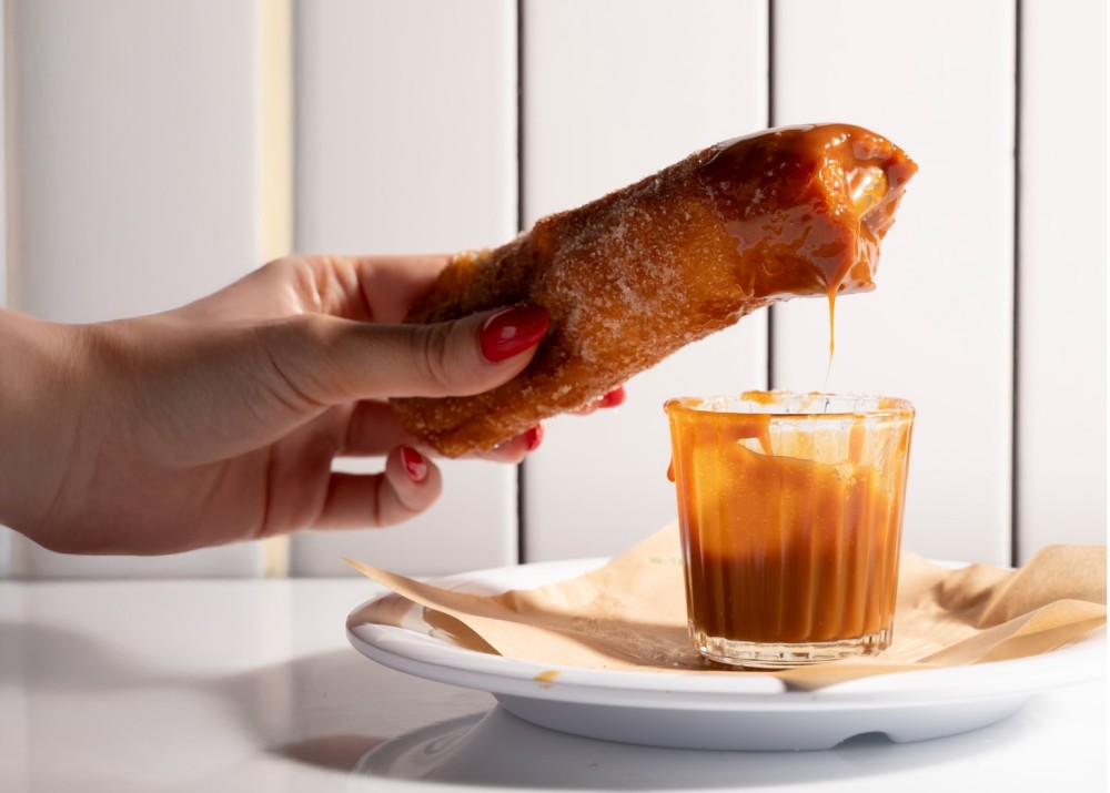 Photo of our famous churro and syrup
