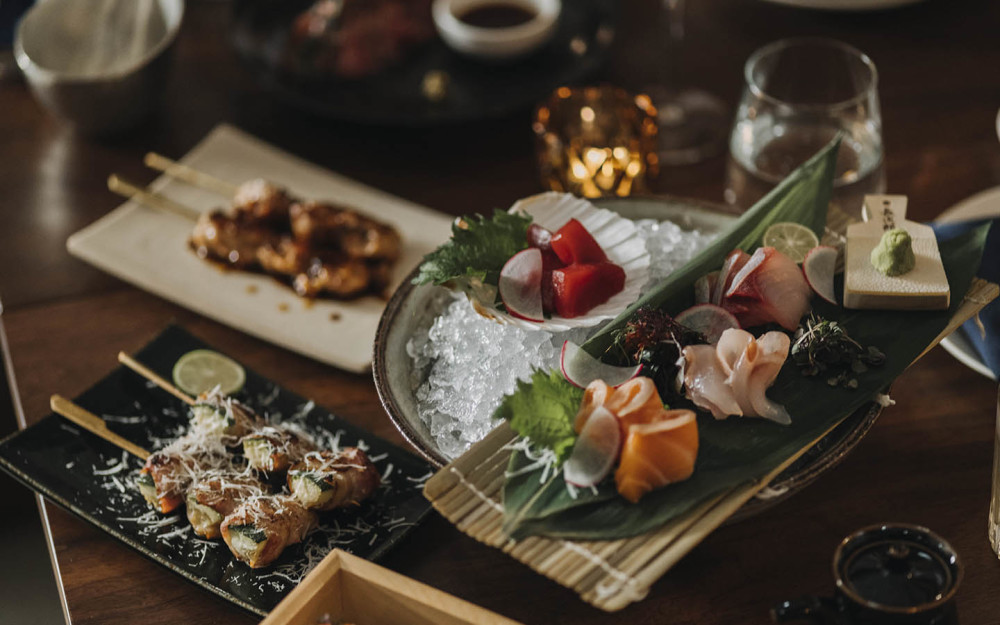 A vibrant display of Azabu’s culinary range, highlighting pristine sashimi alongside expertly grilled robata selections.