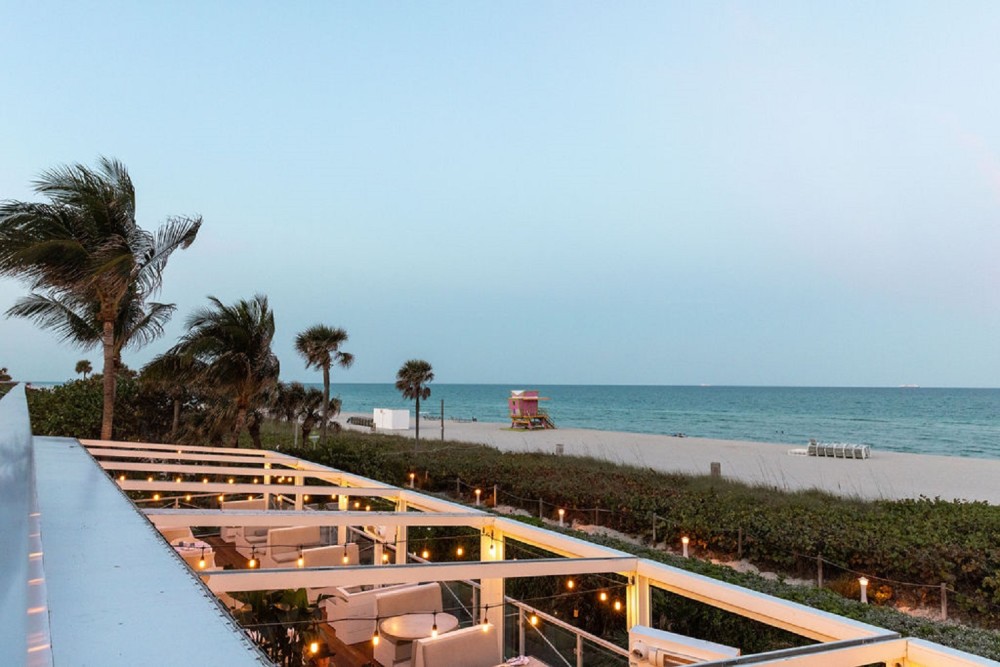 Outdoor dining with the best beach view in Miami Beach.
