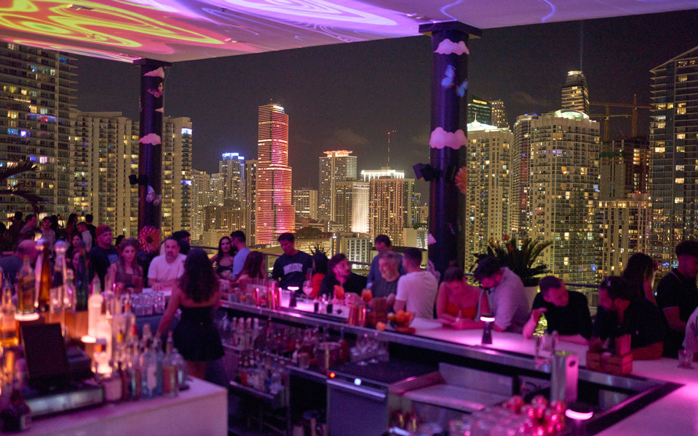 Enjoy happy hour bites and cocktails with a beautiful skyline backdrop