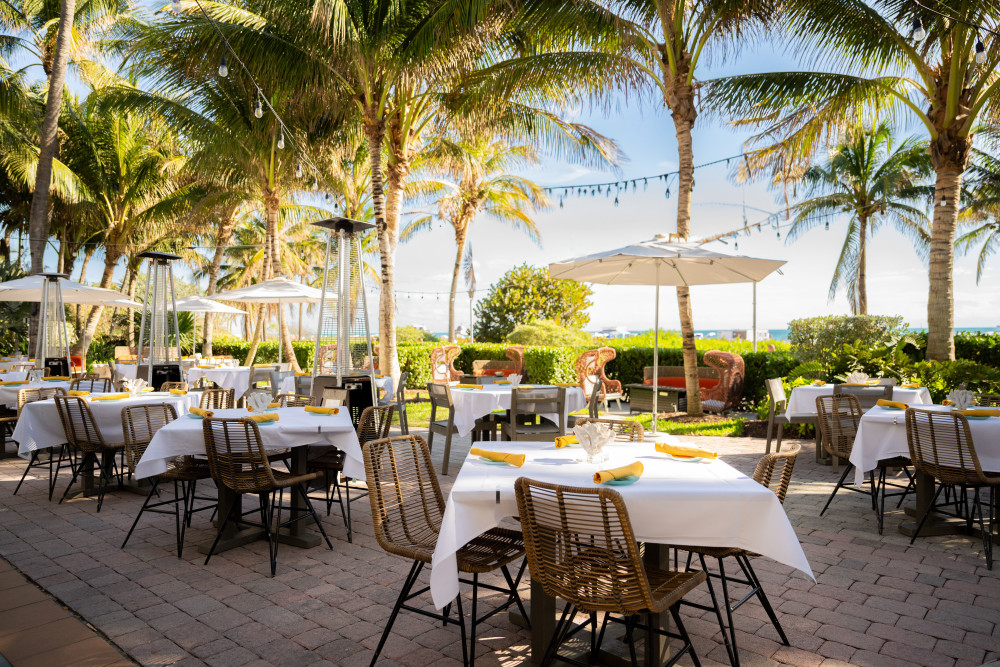 An oceanfront restaurant on South Beach Miami, FL, with a relaxed, chic ambiance.