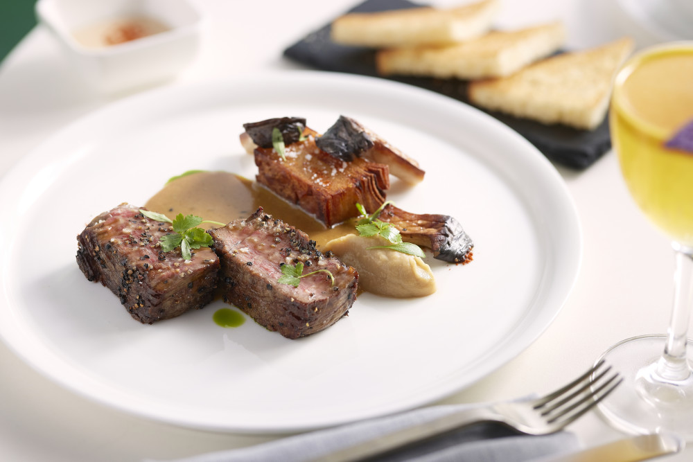 Beef Hanger Steak, brandy sauce, sweet potato cake, confit mushrooms (Antonio Cuellar Photography)