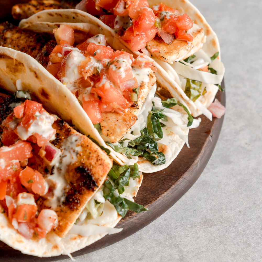 Blackened Mahi, Slaw, Pico, Yuzu Vinaigrette, Cilantro Lime Aioli, Flour Tortilla.