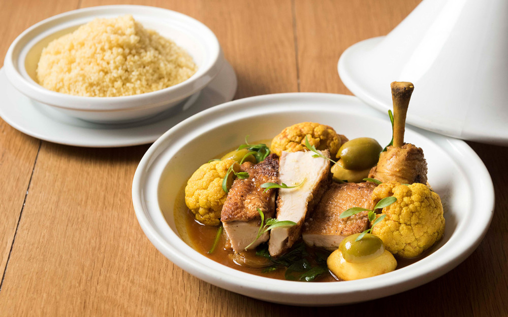 Chicken Tagine, a staple dish at Daniel Boulud's Mediterranean gem.