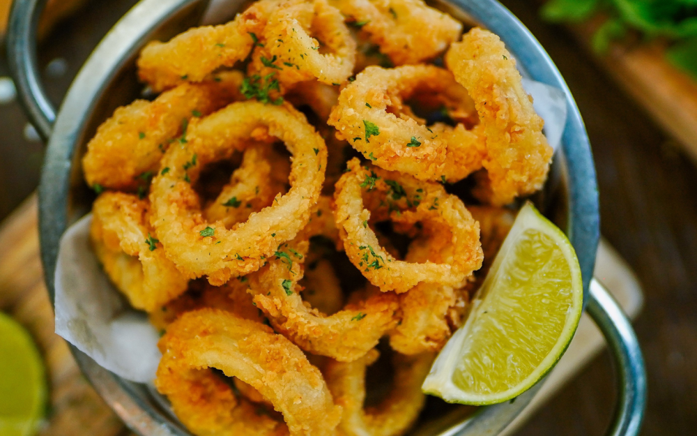 Crispy golden calamari, lightly breaded and fried to perfection, served hot and irresistibly delicious.
