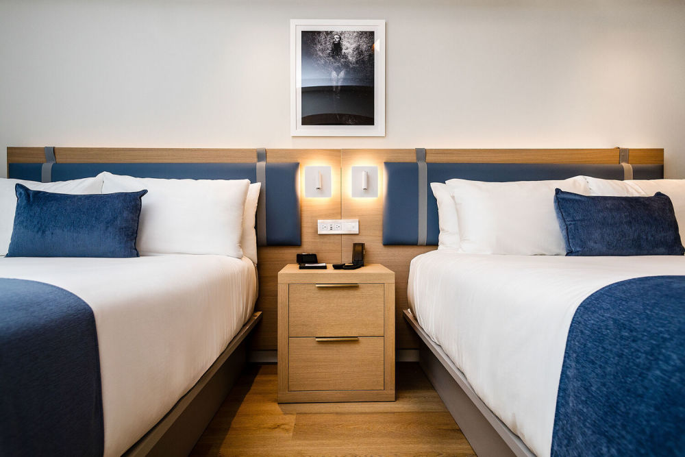 The Balcony Double Room accommodates up to four guests with two queen-size beds.