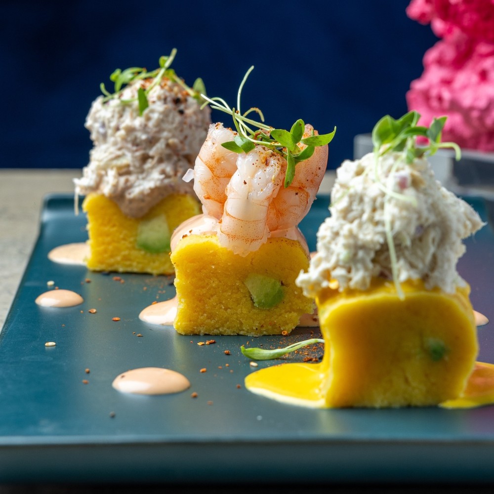Mimi Causas Costazul layers creamy potatoes, fresh seafood, and bold Peruvian flavors into one irresistible bite! 🇵🇪✨