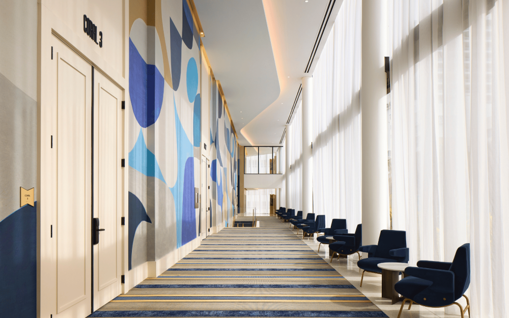 Coral Gallerie bright corridor with high ceilings and modern design accents