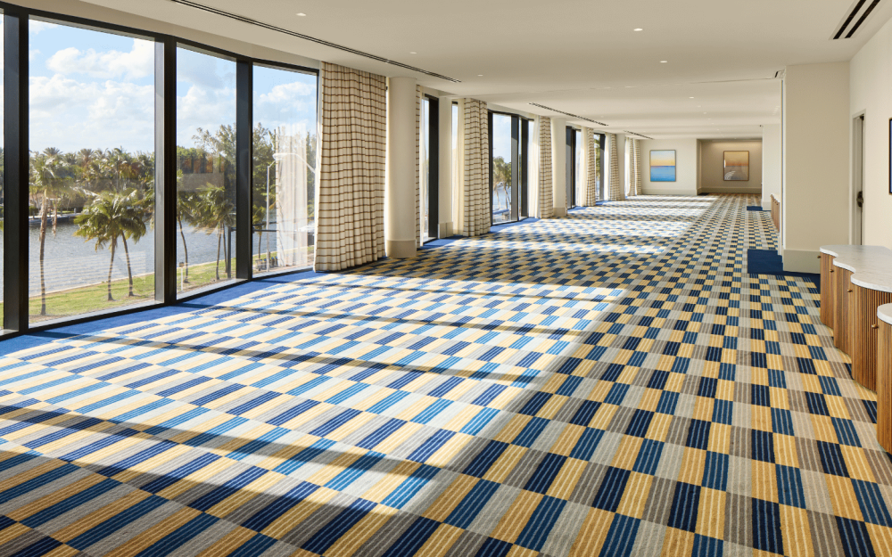Anchor Meeting Room with floor-to-ceiling windows and waterfront views, ideal for corporate meetings