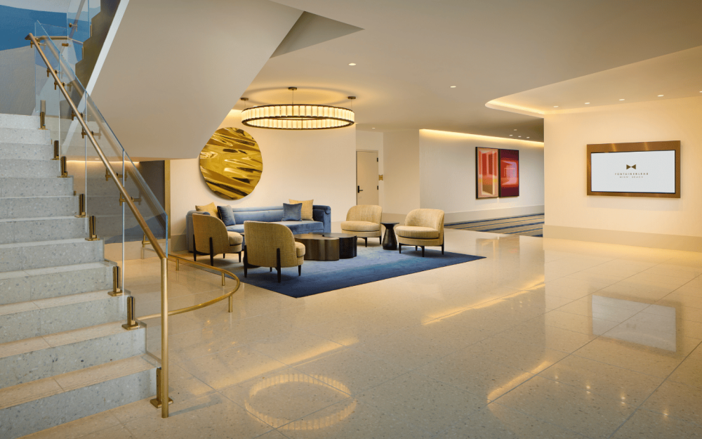 Coral Gallerie North with elegant lounge seating and grand stair for networking and receptions.