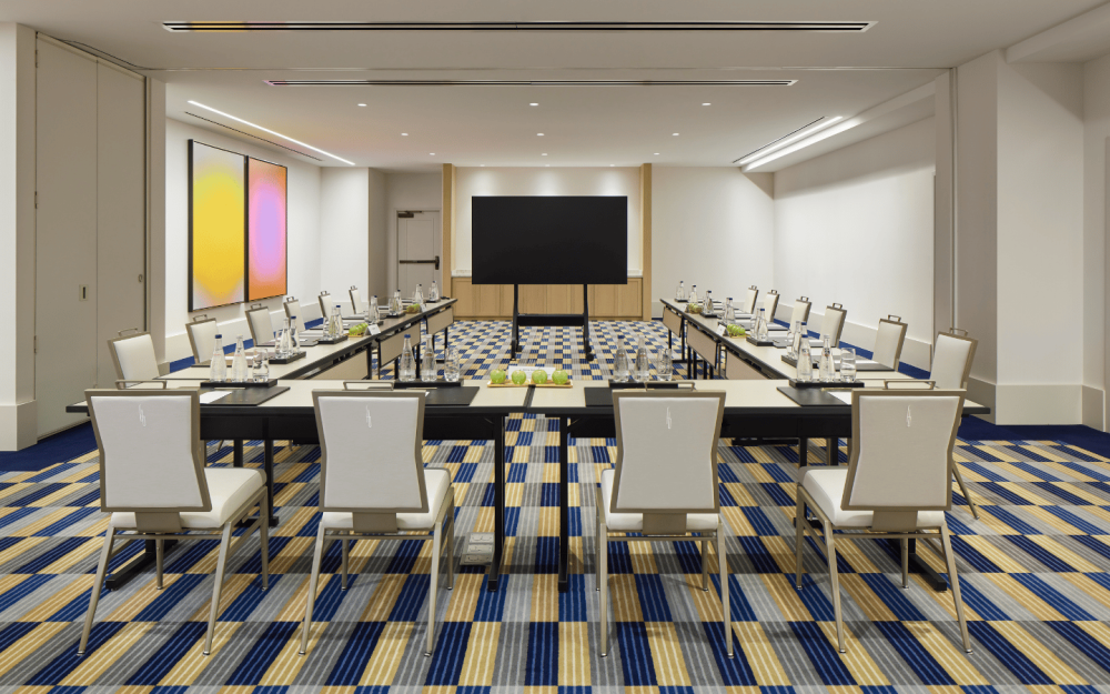 Dune Meeting Room with boardroom setup, screen display, and modern design.