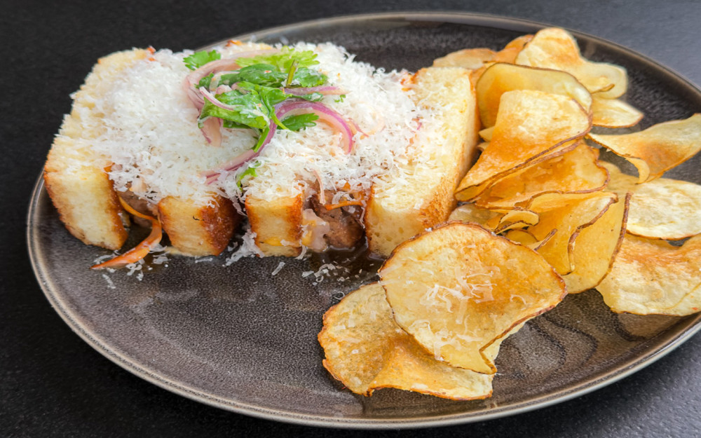 Slow-braised oxtail w/kimchi, demi-glace, Leche de tigre, aioli, Aji Limo, Parmesan.