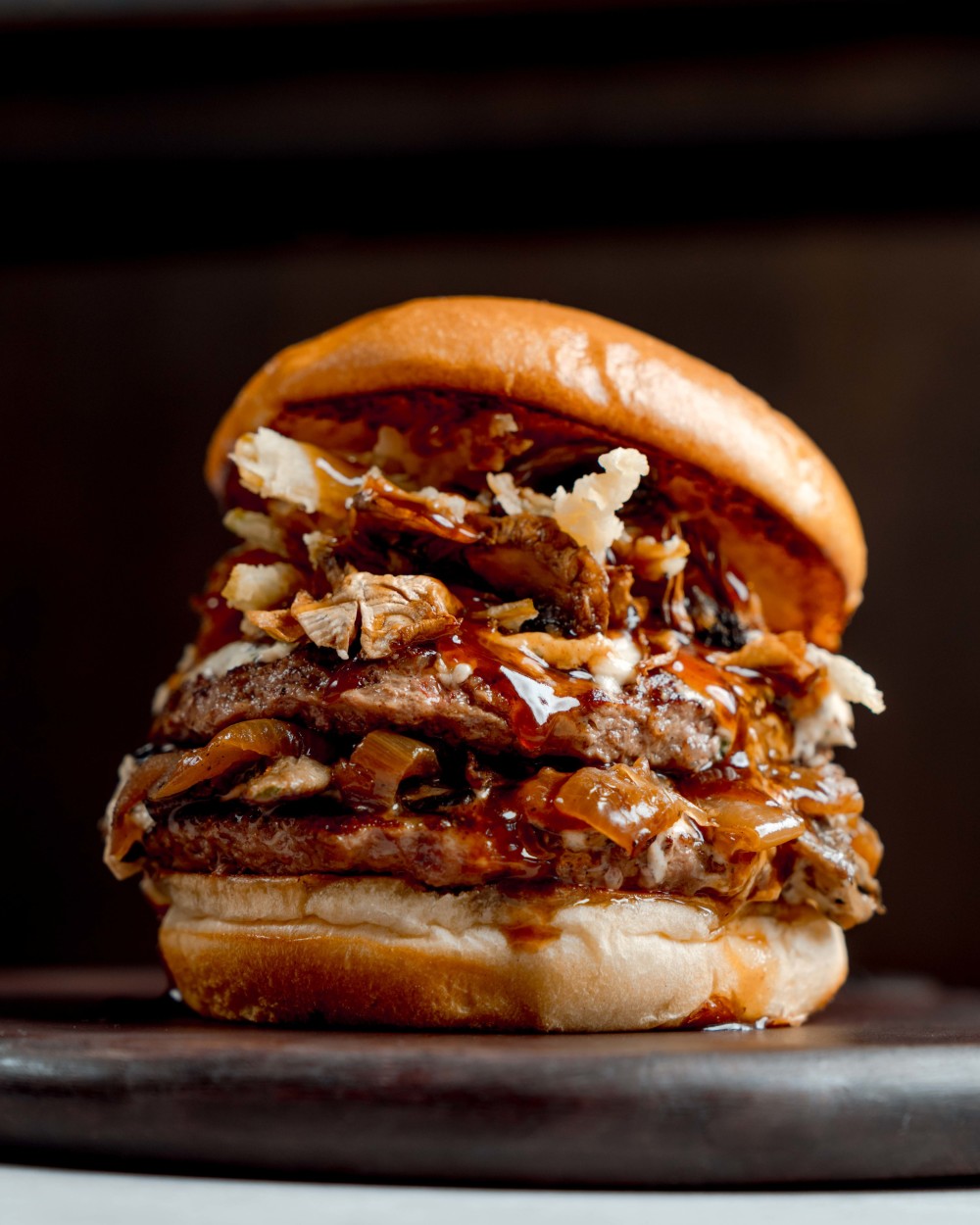 Two 1/4lb. AmSo beef blend patties, truffle boursin, mushroom, onion, crispy leeks, A.1. demi-glace, brioche