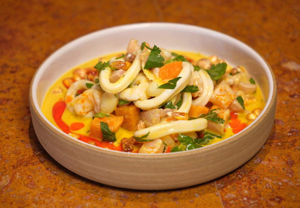 shrimp, calamari, corvina, aji amarillo sauce, sweet potato, corn, cilantro & red onion
