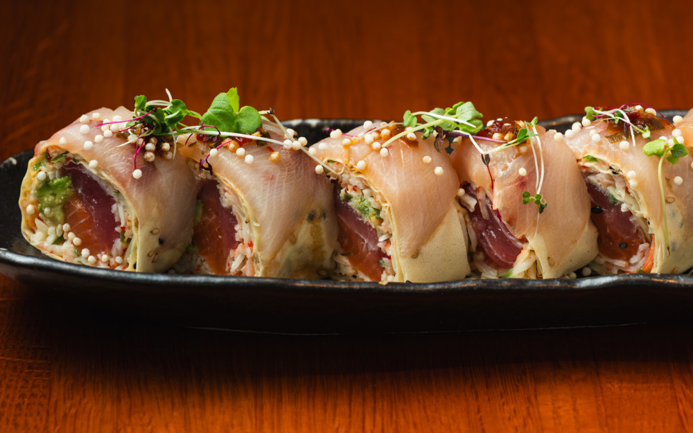 Sottish Salmon, Tuna, Osaki kani Salad, Avocado, Topped w/ Hamachi, Spicy Ponzu, Soy Paper