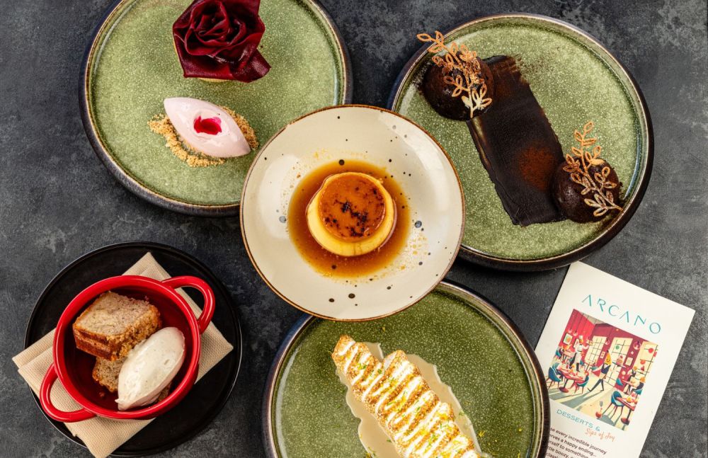 Assorted desserts with Flan de Maiz, Tres Leches de Almendra, Flourless Chocolate Cake, and Pan de Platano