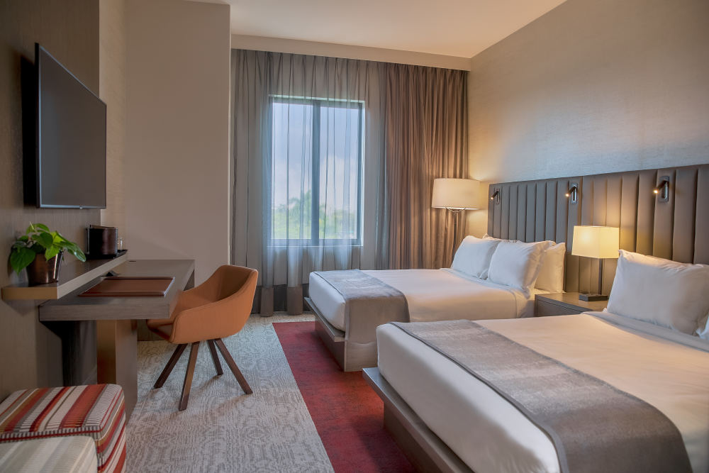 Experience the Thesis way with two plush queen beds that make this room the perfect choice for those who need an extra bed.