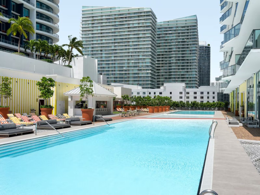 Hotel pool area with cold plunge and hot tub.
