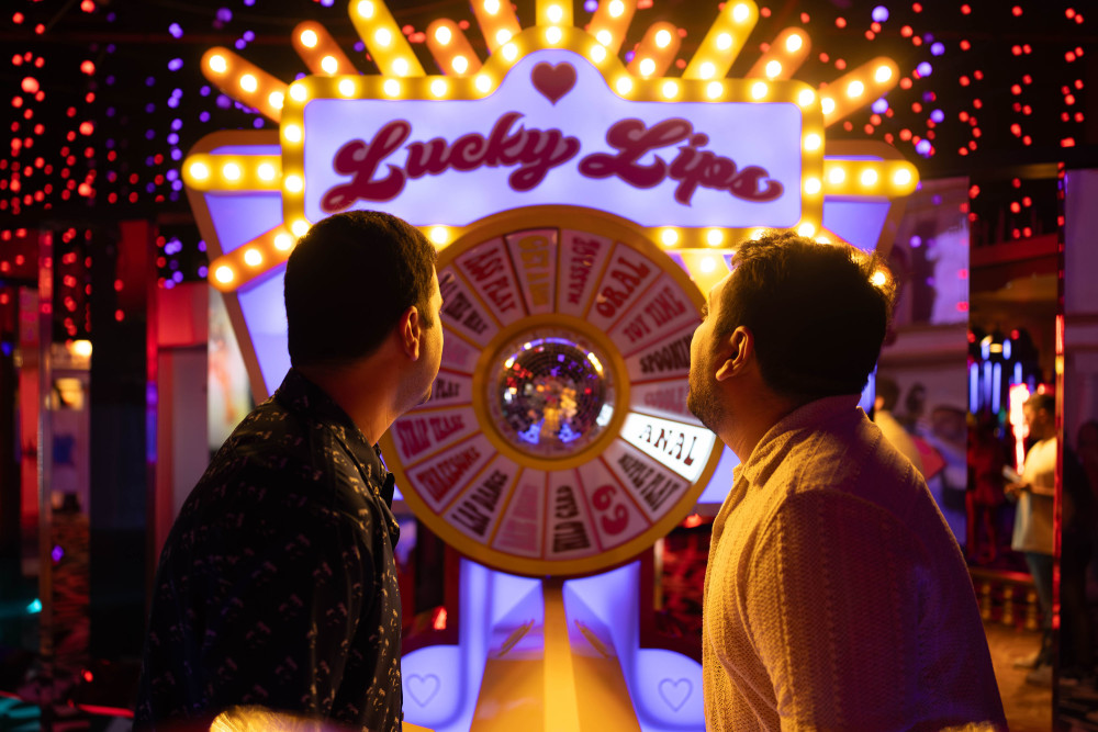 Two guys looking toward the Lucky Lips