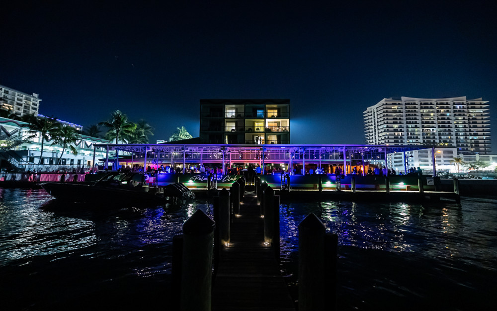 Pull up by boat, step into the vibe—dock-and-dine under the stars at Palm Tree Club, where waterfront nights are always on the menu.