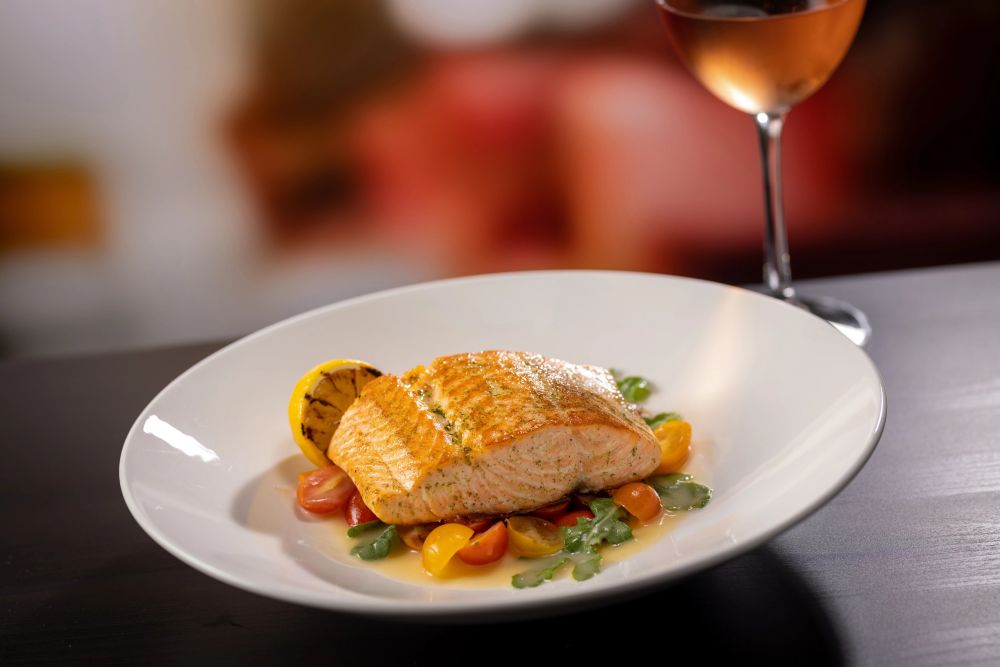 Seared Salmon with Heirloom Tomatoes, White Wine Butter and Lemon Basil Mosto