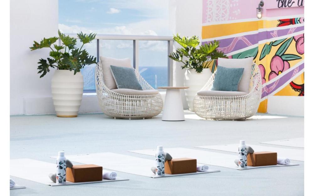 Elevate your practice on our rooftop terrace, where ocean breezes, colorful murals, and Miami skies set the tone for total relaxation.