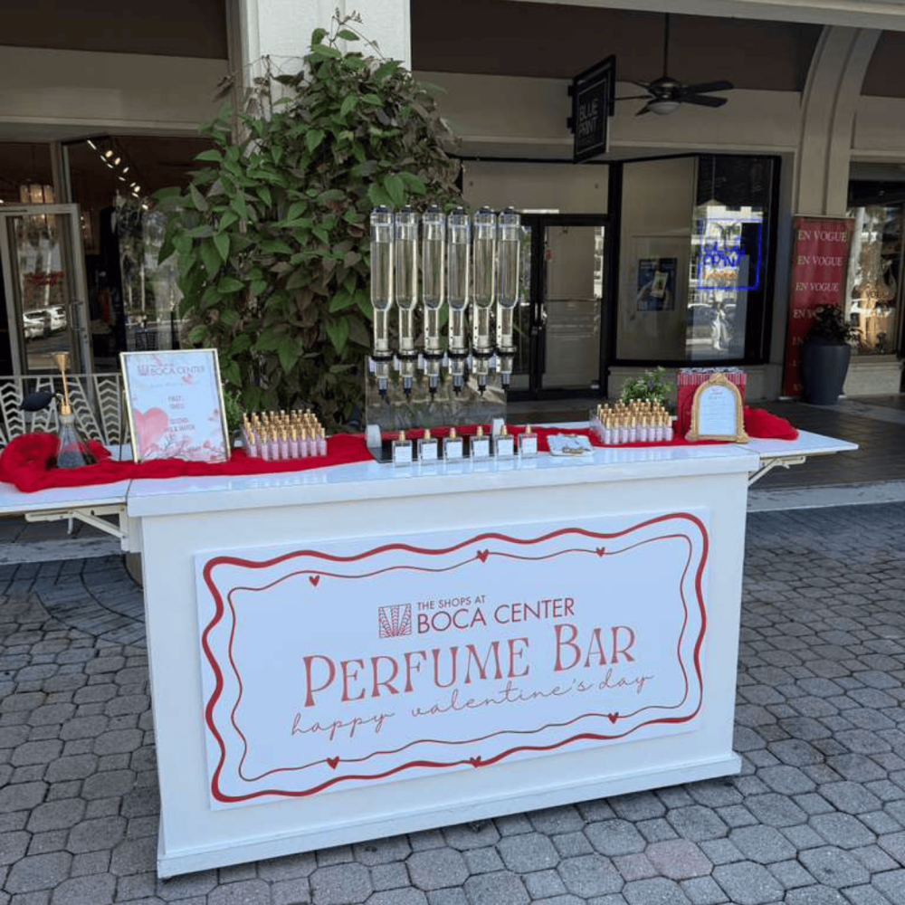Outdoor perfume bar setup with branding design for Valentines