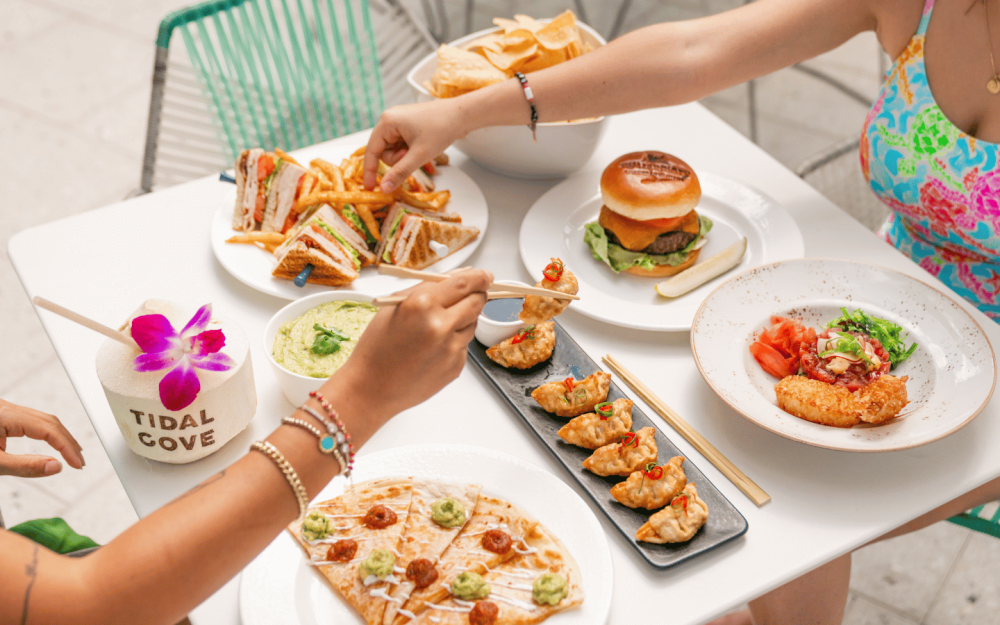 Enjoy delicious menu items poolside at Freestyle within Tidal Cove.