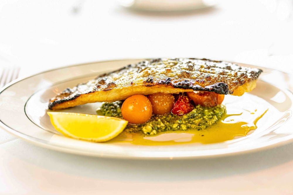 Spanish Branzino with Confit Everglade Tomatoes and a Macadamia Nut Pesto