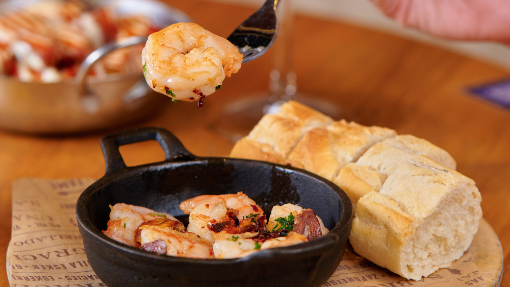 GAMBAS AL AJILLO - Sautéed shrimp, garlic, brandy, pepper flakes