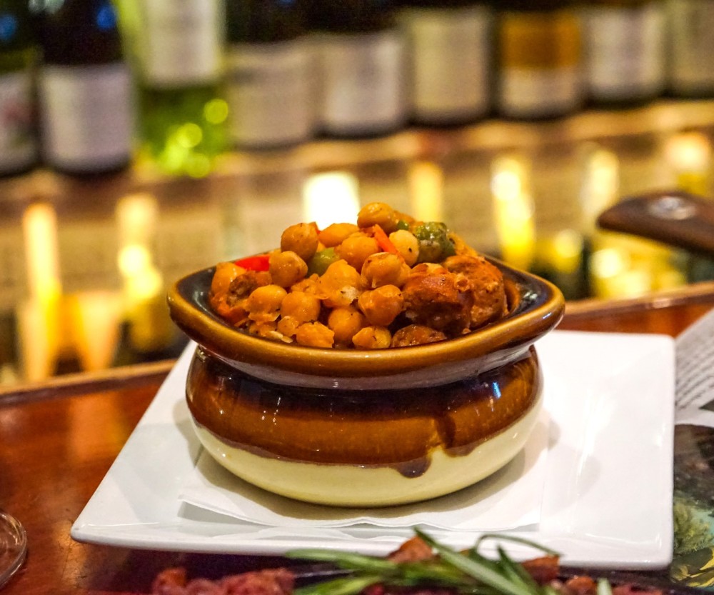 Classic Spanish Garbanzo: Chickpeas cooked in ham broth, with Serrano ham and Spanish chorizo.