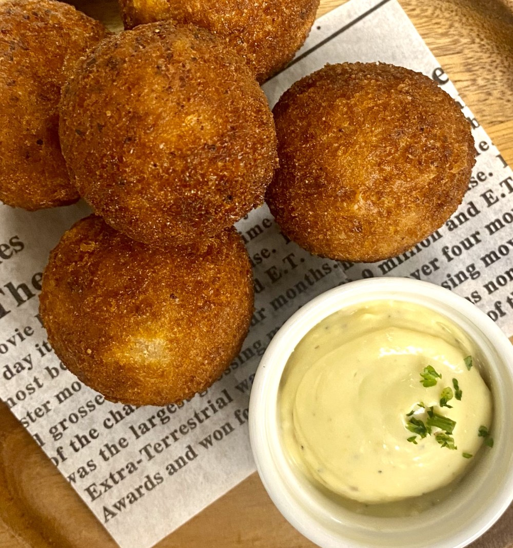 Ham Croquetas: Deep fried to crispy perfection croquettes stuffed with ham or chorizo and served with roasted garlic aioli.