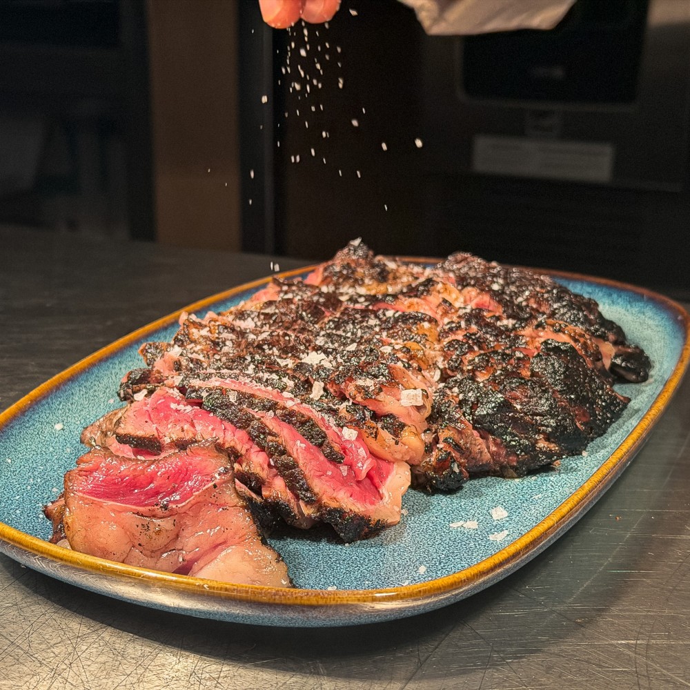 Prime Top Sirloin Cap, Grilled, Accompanied by French Fries.