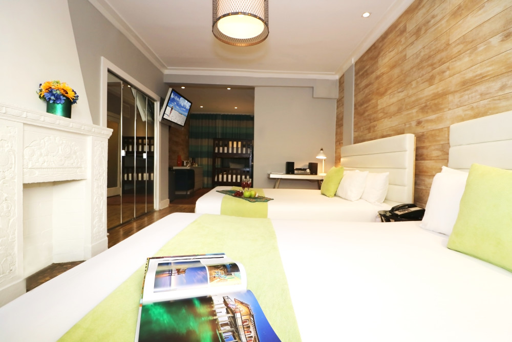 Memorable family vacations begin with this spacious Family Room featuring two queen beds and two twin bunk beds that sleeps up to six people. Our open floor plan offers a large bath with Jacuzzi tub, sitting area, extra large LCD's, iPod docking stations, Minibar, CD Player.
