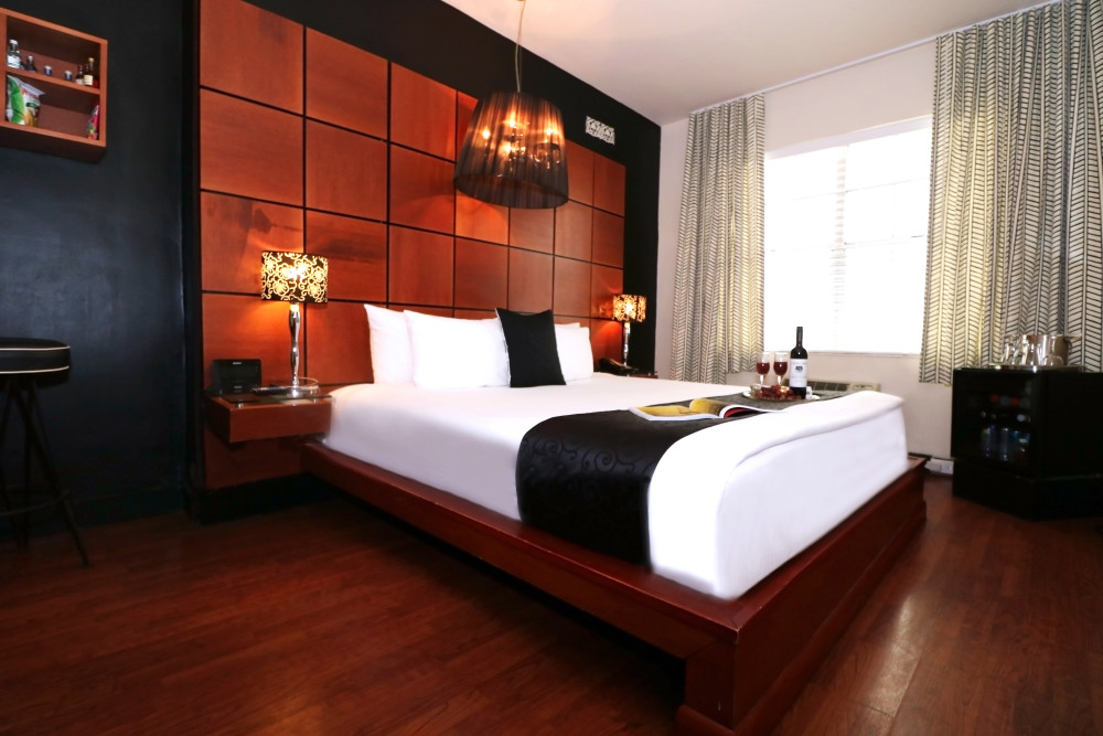 These stylish King Rooms offer a comfortable pillowtop bed with luxurious Egyptian cotton linens and Duvet that tucks you in for a restful night or a quick nap before heading out on the town. Our bathrooms offer a cascading rain shower to wash your cares away. The ultra-modern décor combines an eclectic array of mahogany furnishings, raw materials, and aluminum accents. Occupancy is limited to two persons.