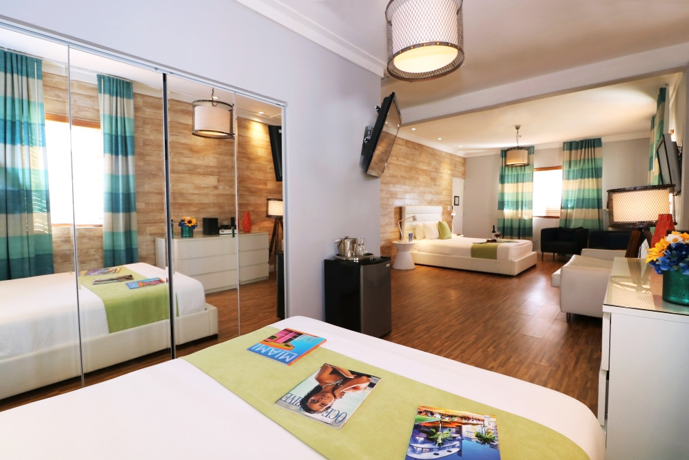 Our Premium Room is beautifully furnished with two queen beds and a sofa bed. Large bath with a Jacuzzi tub has an open floor plan, so there’s no room to be shy! Room features custom closets, sitting area, extra large LCD's, IPod docking stations, minibar, CD Player. Occupancy is limited to five persons.