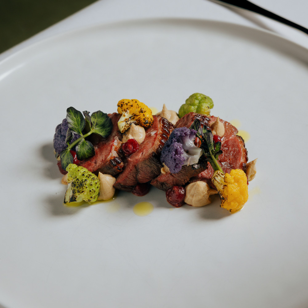 Burnt cauliflower cream, figs, and orange demi‑glace