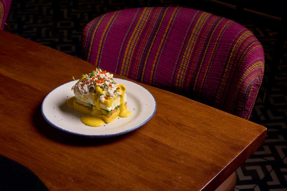 Causa Casera
Classic Peruvian layered potato with chicken, avocado, tomato, and egg