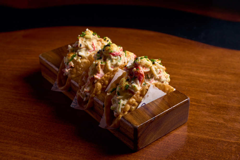 Crispy wonton tacos filled with Nikkei-style tuna tartare, avocado, and ají amarillo cebichera sauce.